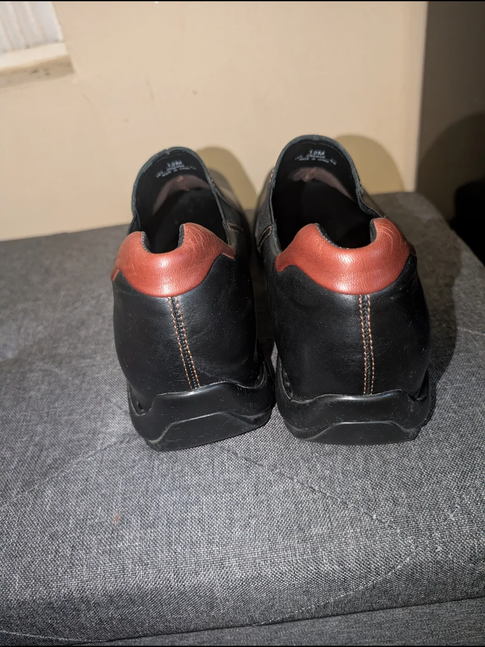 Cole Haan Black Leather Slip-On Loafers with Brown Heel Accent